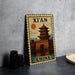 A vintage-style metal sign depicting a Chinese temple with a sun in the background, placed on a gray countertop next to some black camera lenses.