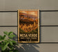 A vintage-style sign for the mesa verde national park in the United States, featuring an illustration of a desert town.