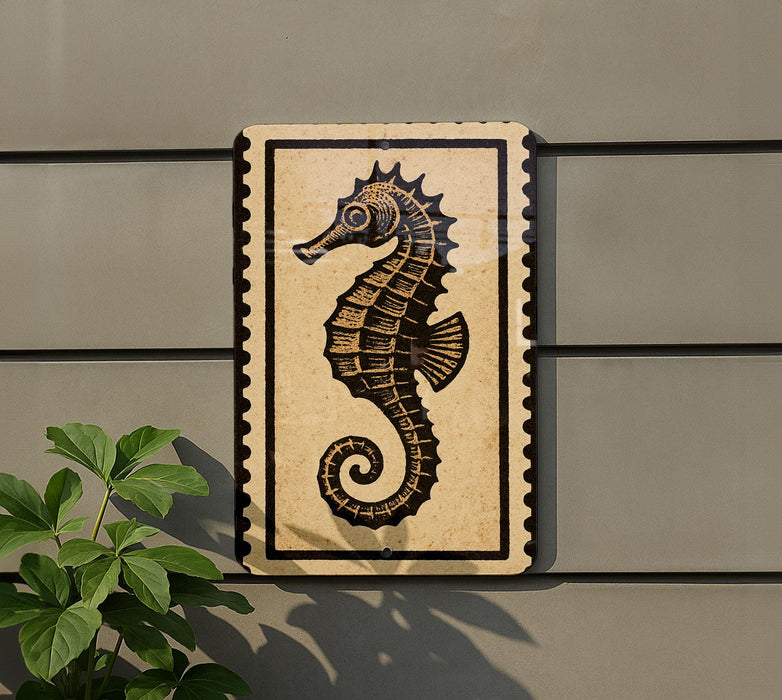 a seahorse on a wall, with a plant to the left of the seahorse.