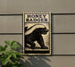 a sign with the text "HONEY BADGER" and an illustration of a badger.