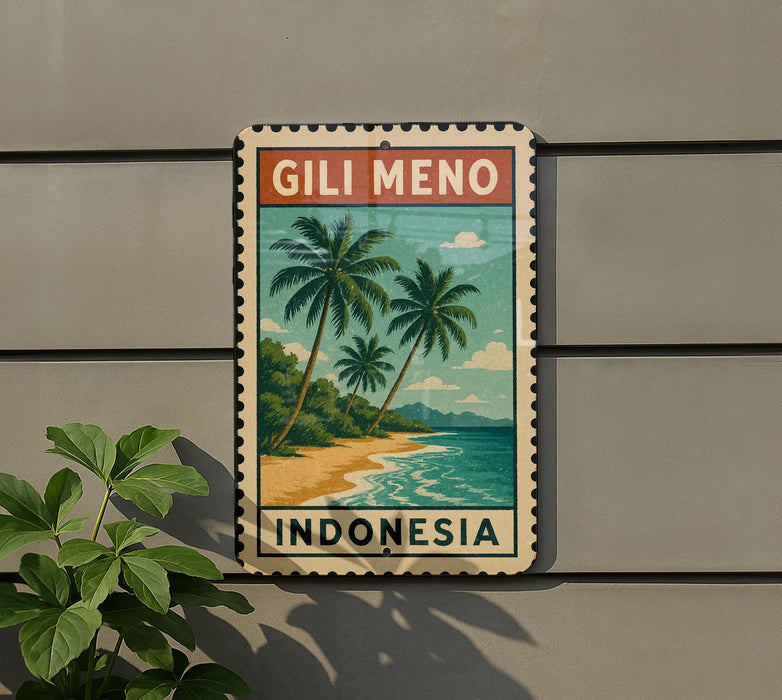 A vintage postage stamp featuring a tropical beach scene with palm trees and a body of water, mounted on a wall next to a plant.