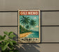 A vintage postage stamp featuring a tropical beach scene with palm trees and a body of water, mounted on a wall next to a plant.