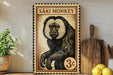 a wooden sign with a monkey illustration, placed on a wooden surface next to a wooden cutting board and some lemons.