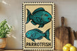 a framed illustration of two parrotfish on a wooden surface, with a potted plant to the left and a wooden cutting board to the right.