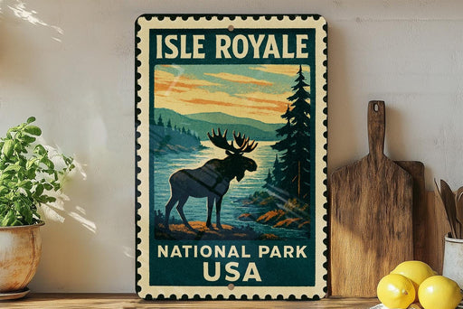 A vintage-style metal sign for Isle Royale National Park, featuring a moose silhouette against a scenic landscape.