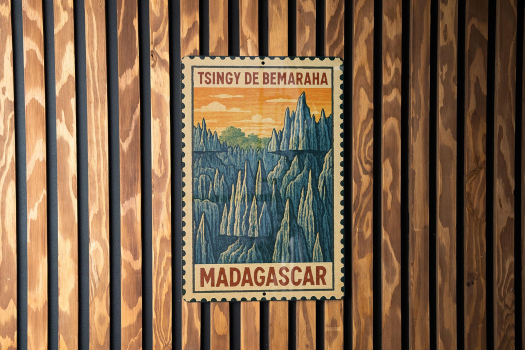 A vintage postage stamp from Madagascar, featuring a mountainous landscape with pine trees and a sunset sky.