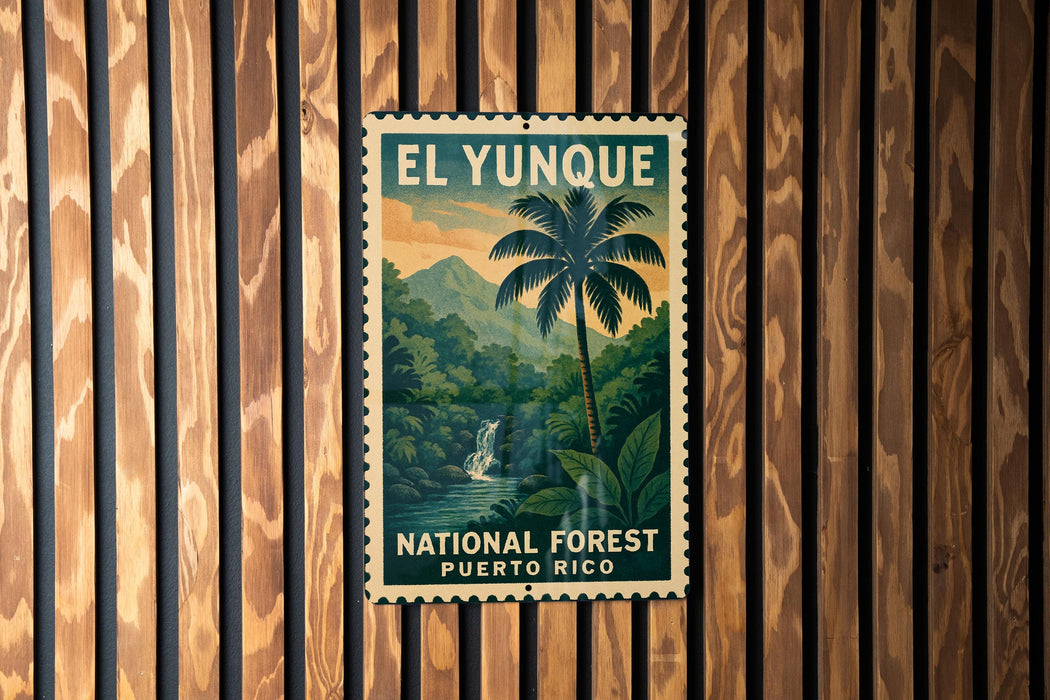 A vintage-style poster of the National Forest in Puerto Rico, featuring a palm tree and a waterfall, is displayed on a wooden wall.