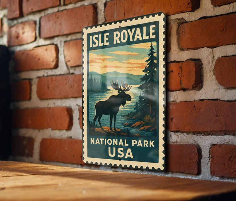 A vintage-style metal sign for Isle Royale National Park in the United States, featuring a moose silhouette against a scenic landscape.