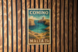 A vintage postage stamp from Malta, featuring a scenic coastal landscape with cliffs and a turquoise sea.
