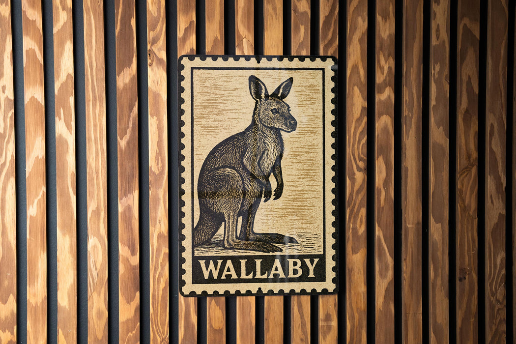 A wall-mounted metal sign featuring a kangaroo illustration and the word "WALLABY".