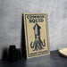 a sign with the text "Common Squid" and "LOLIGO VULGARIS" printed on it, along with an illustration of an octopus.