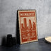 A metal stamp with the text "Milwaukee, Wisconsin, USA" printed on it, featuring an illustration of the Milwaukee skyline.