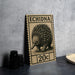 a wooden postcard with a picture of an echidna, which is a type of insect, and the text "ECHIDNA 20c" printed on it.