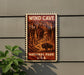 a vintage-style sign for the Wind Cave National Park in the United States, depicting a bison in a cave setting.