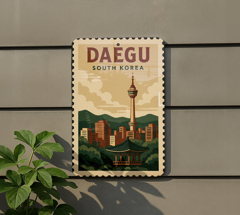 A vintage-style poster of the Daegu Tower, a famous landmark in South Korea, is displayed on a wall.