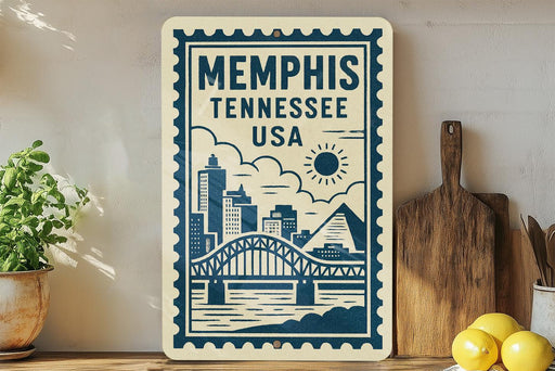 A framed sign displaying the text "Memphis, Tennessee, USA" along with a graphic of a bridge and city skyline.