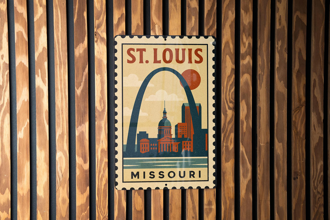 A vintage-style metal sign with the text "ST. LOUIS MISSOURI" and an illustration of the Gateway Arch, a famous landmark in St. Louis, Missouri.