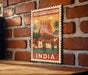 A vintage-style postage stamp depicting the Thiruvannathanam Temple in India, with a brick wall and palm trees in the background.