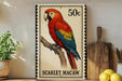 A postage stamp featuring a colorful parrot, specifically a red and blue macaw, perched on a branch.