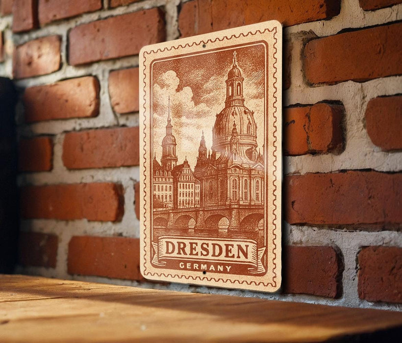 a wooden sign with an illustration of Dresden, Germany, mounted on a brick wall.