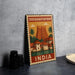 A vintage-style metal sign with an illustration of a temple and buildings, labeled "Thiruvannanthapuram, India".