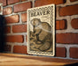 a wooden table with a metal plate featuring a beaver illustration on it, mounted on a brick wall.