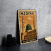 A metal sign with the text "MEDINA SAUDI ARABIA" and an illustration of the Prophet's Mosque in Mecca, Saudi Arabia.