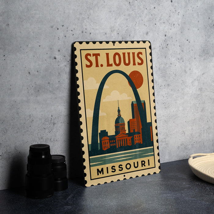 A metal sign with the text "ST. LOUIS MISSOURI" and an illustration of the St. Louis arch, which is a famous landmark in Missouri.