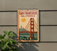 A vintage-style sign for San Francisco, California, featuring the iconic Golden Gate Bridge and the city skyline.