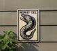 a sign with a black and white illustration of a fish, mounted on a wall.