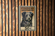 A sign for a Pyrenean Shepherd dog, with the price of 50 cents.