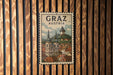 A vintage postage stamp from Austria featuring a cityscape with a church spire and other buildings.