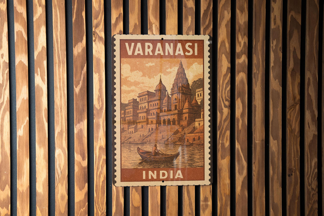 A vintage postage stamp from India featuring a boat on a river, with a temple in the background.