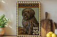 A framed illustration of a shaggy dog, likely a Berggamenco dog, is displayed on a wall next to a wooden cutting board and some kitchen utensils.