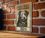 A sign featuring a black and white illustration of a Pyrenean Shepherd dog, with the text "PYREAN SHEPHERD" and the price "50c" below the image.