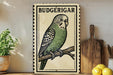 A vintage-style metal sign featuring a detailed illustration of a Budgerigar, a small parakeet, perched on a branch. The sign is framed with a decorative border and is displayed on a wooden shelf, accompanied by a potted plant and a wooden cutting board.