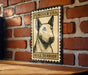 A metal sign with a bull terrier illustration and the text "Forever USA Bull Terrier" is displayed on a brick wall.