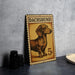 A metal sign featuring a dachshund dog, with the text "DACHSHUND" and the denomination "5c" printed on it.