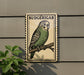 A sign featuring a Budgerigar, a small parrot, perched on a branch.