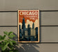 A vintage-style metal sign with the text "CHICAGO ILLINOIS USA" displayed on it, featuring an illustration of the Chicago skyline.