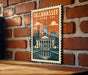 A framed illustration of the Tallahassee, Florida, USA, with a brick wall and a fountain in the background.