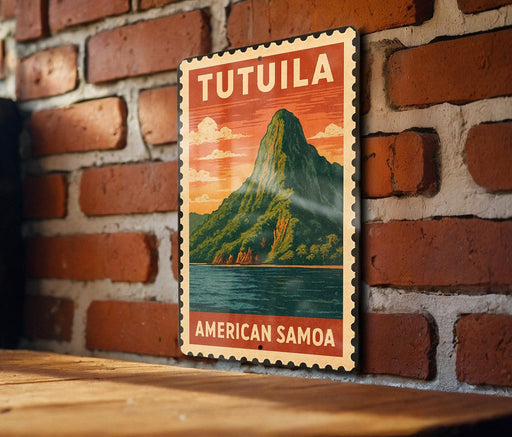 A vintage-style metal sign with the text "TUTUILA AMERICAN SAMOA" displayed on a brick wall.