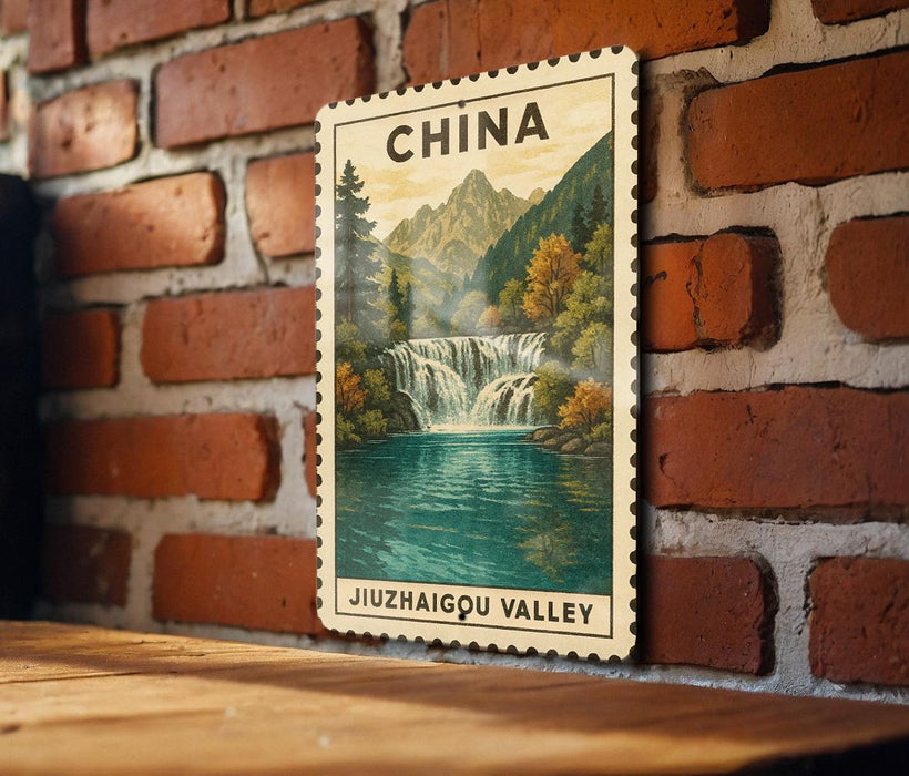 A framed postcard depicting a scenic waterfall in the Jiuzhaigou Valley, with mountains in the background.