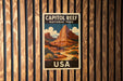 A vintage-style poster of Capitol Reef National Park in the USA, featuring a mountain landscape with a winding road and desert vegetation.