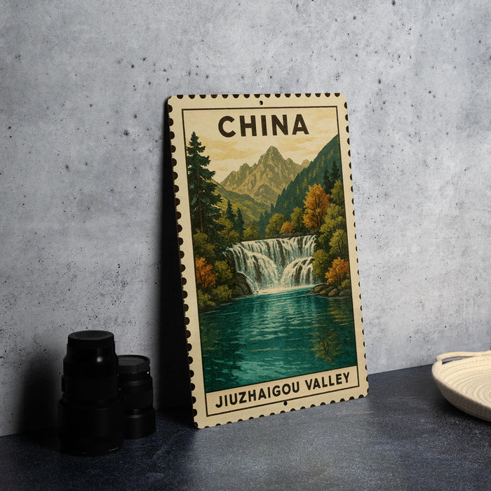 A framed poster of a waterfall in Jiuzhaigou Valley, China, with a mountain backdrop.