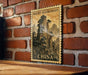 A framed poster of a mountain landscape with the text "Mount Huangshan" and "CHINA" printed on it, mounted on a brick wall.