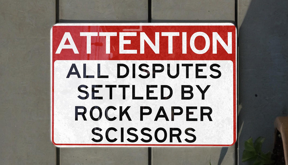 a red and white street sign on a wall