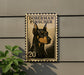 A metal sign featuring a Doberman Pinscher dog, with the text "DOBERMAN PINSCHER" and the number "20" printed on it.