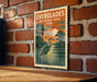 A vintage-style postage stamp featuring a seagull and a landscape with a body of water, mounted on a brick wall.