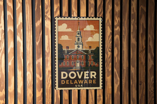 A vintage-style postage stamp featuring a building with a steeple, hanging on a wooden wall.
